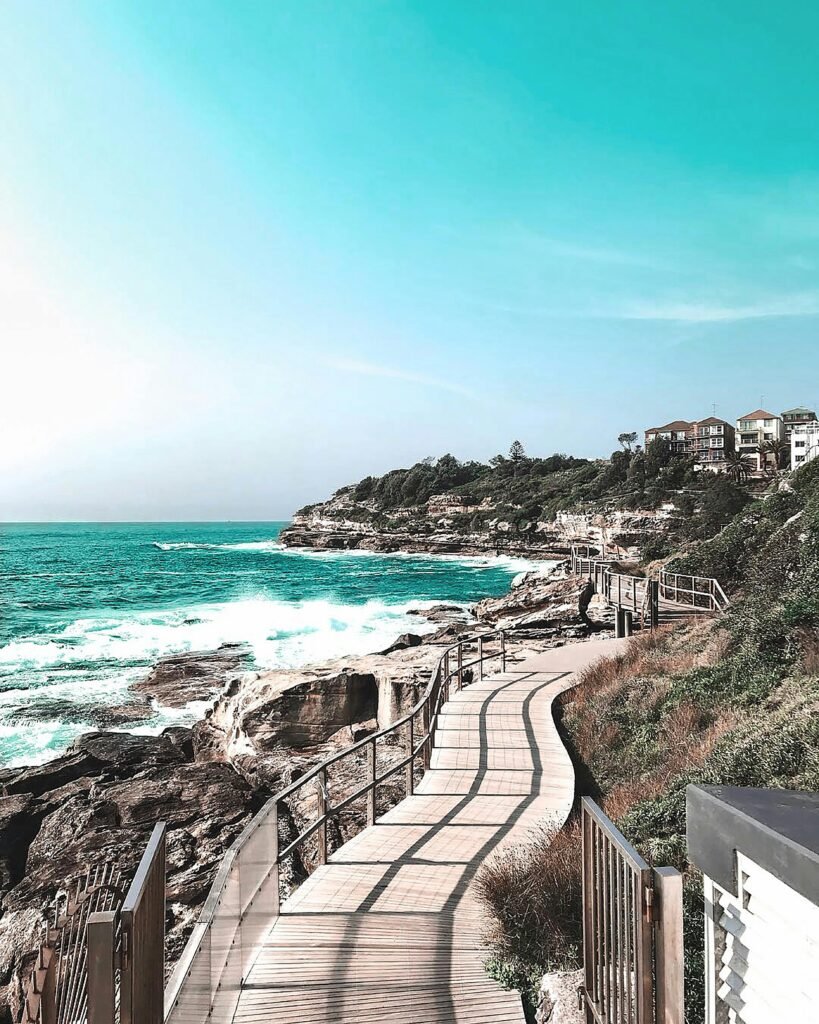 pexels-photo-2265880-2265880 A picturesque coastal pathway along Bondi Beach, capturing the vibrant sea and sky.